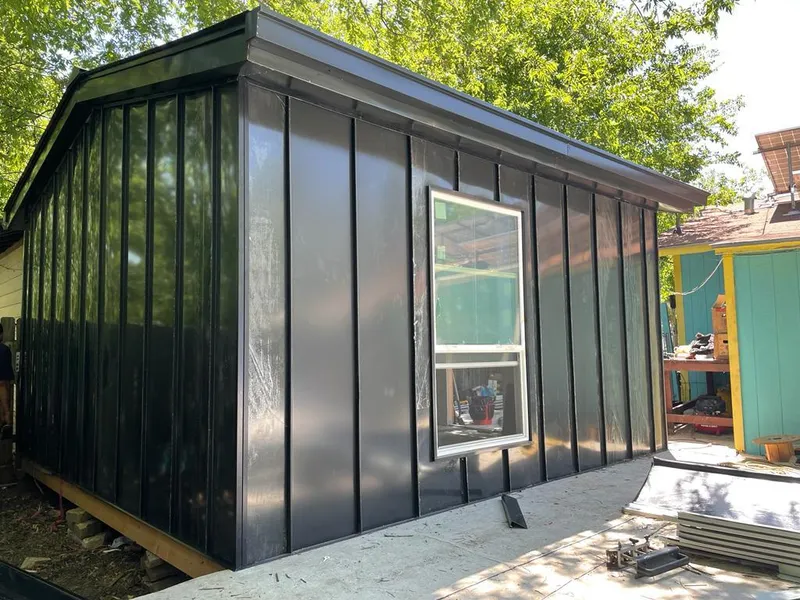 Black standing seam metal wall panels for Roof Inspection in Graham